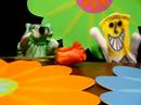 Picture of Mr. I. Fry and Gus the Green Bear with a flower.